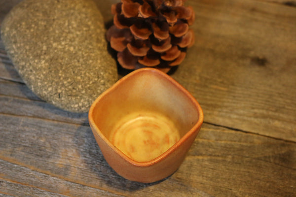 small orange bowl with square rim