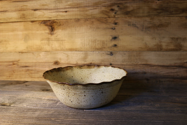 Brown bowl with ruffled edge
